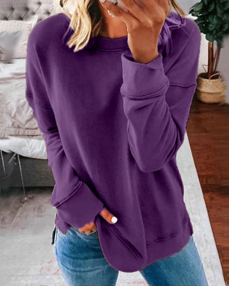 Dame afslappet sweatshirt med rund hals og sidesplit
