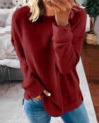 Dame afslappet sweatshirt med rund hals og sidesplit
