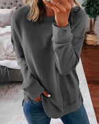 Dame afslappet sweatshirt med rund hals og sidesplit