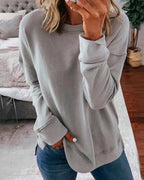 Dame afslappet sweatshirt med rund hals og sidesplit