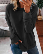 Dame afslappet sweatshirt med rund hals og sidesplit